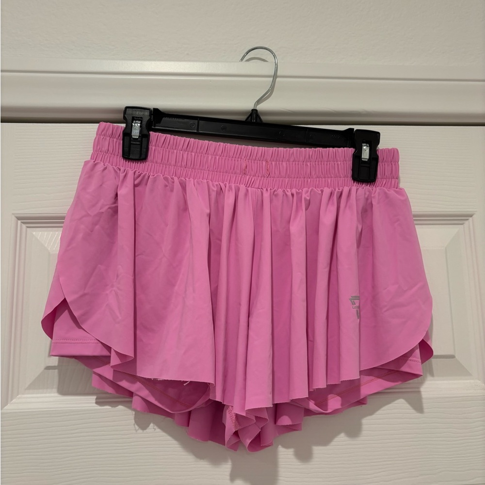 Super cute and flowy pink workout shorts! Built in spandex!